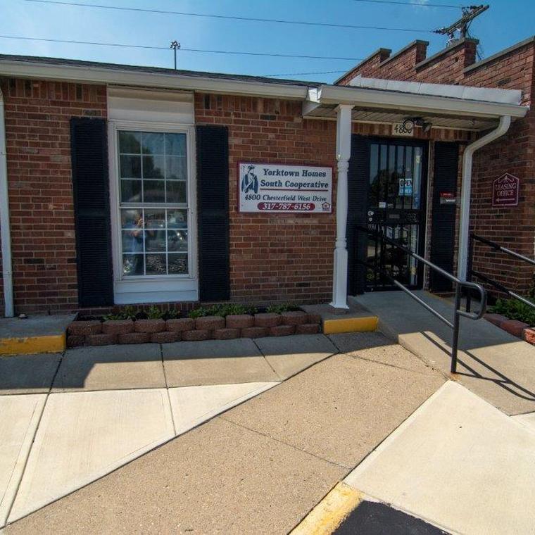 Brick leasing office entrace with handicap accessible ramp